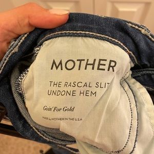 Dark wash inner ankle slit frayed bottom Mother jeans